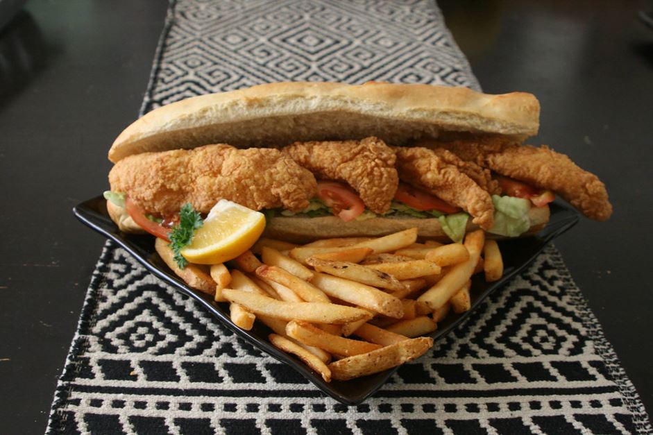 Freshly fried catfish stacked on fresh French bread. Served "dressed" with lettuce, tomato, and pickles with a choice of regular or chipotle mayonnaise.