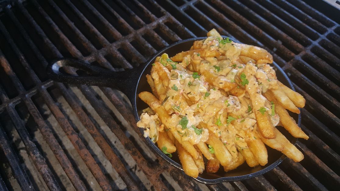 Crispy French fries smothered in our signature crawfish queso sauce.