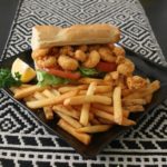 Crispy fried shrimp piled on a 6 inch fresh French Served "dressed" with lettuce, tomato, and pickles with a choice of regular or chipotle mayonnaise.