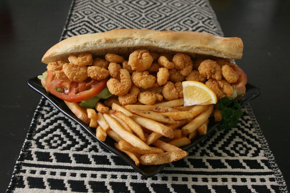 Crispy fried shrimp piled on a fresh French Served "dressed" with lettuce, tomato, and pickles with a choice of regular or chipotle mayonnaise.